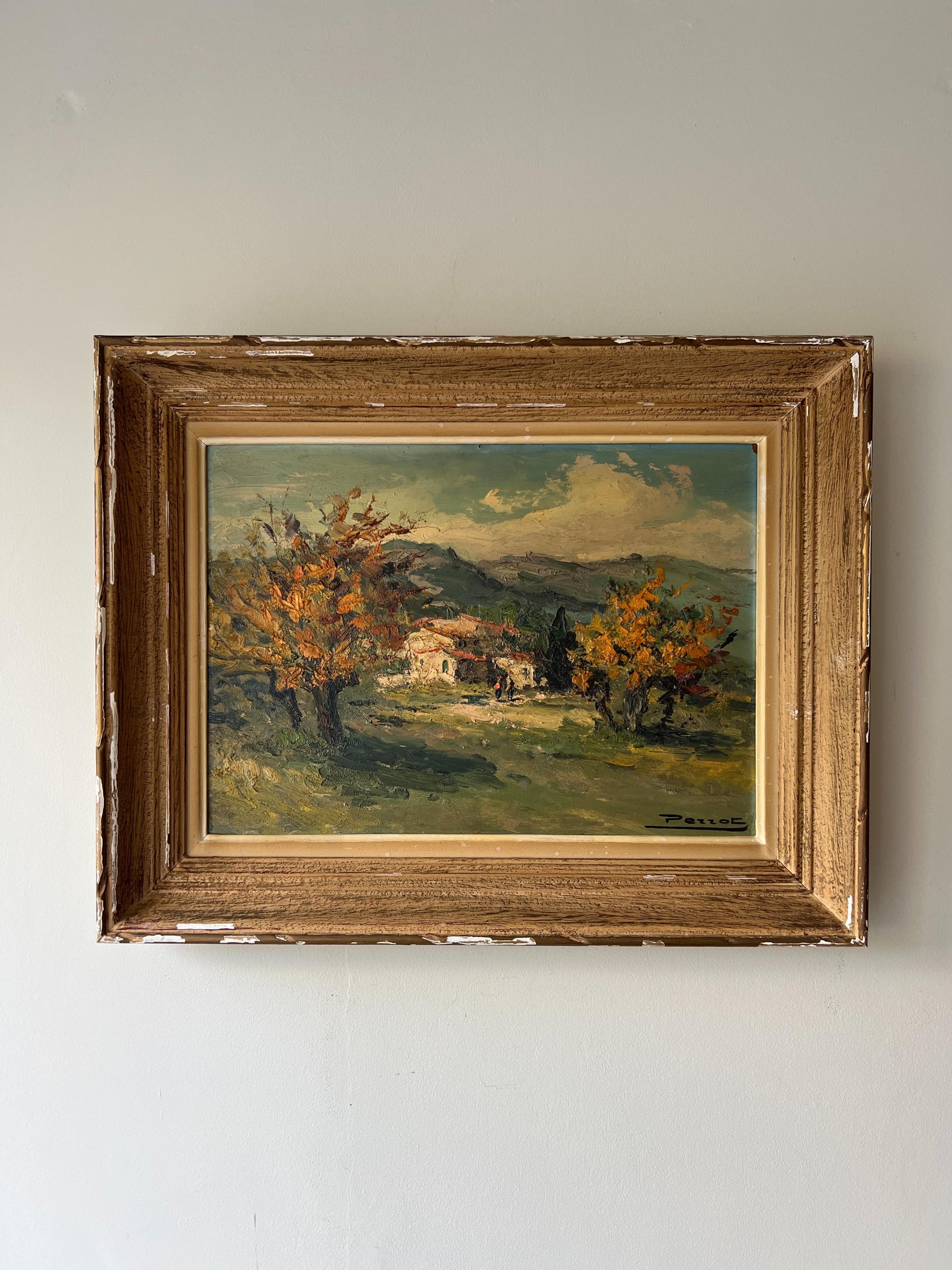 Framed vintage oil painting of a landscape with trees and mountains. Available at Hue.