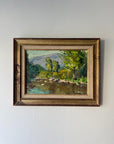 Framed vintage oil painting of a riverside landscape with trees and water. Available at Hue. 