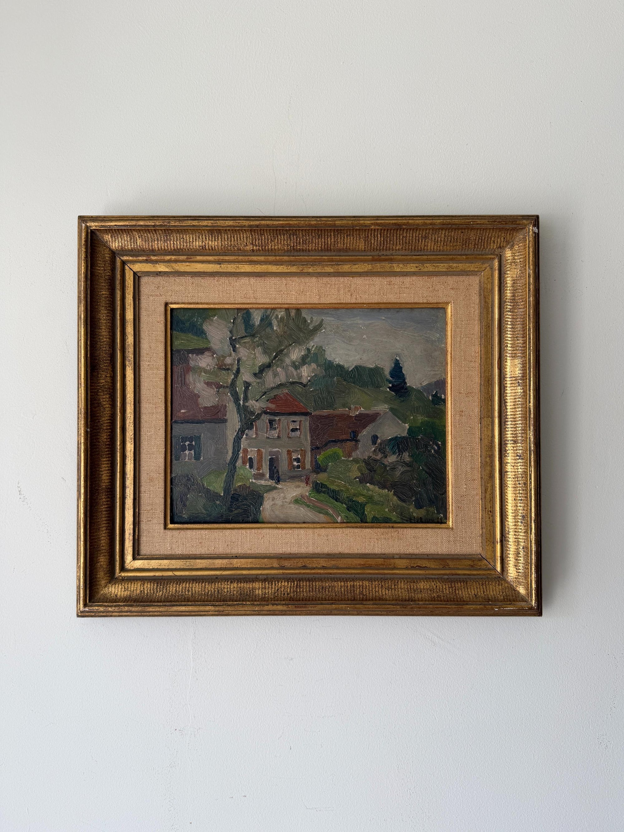 Framed vintage oil painting of a landscape with a house. Available at Hue. 