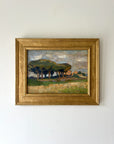 Framed vintage landscape painting of pine trees and a farmhouse. Available at Hue. 