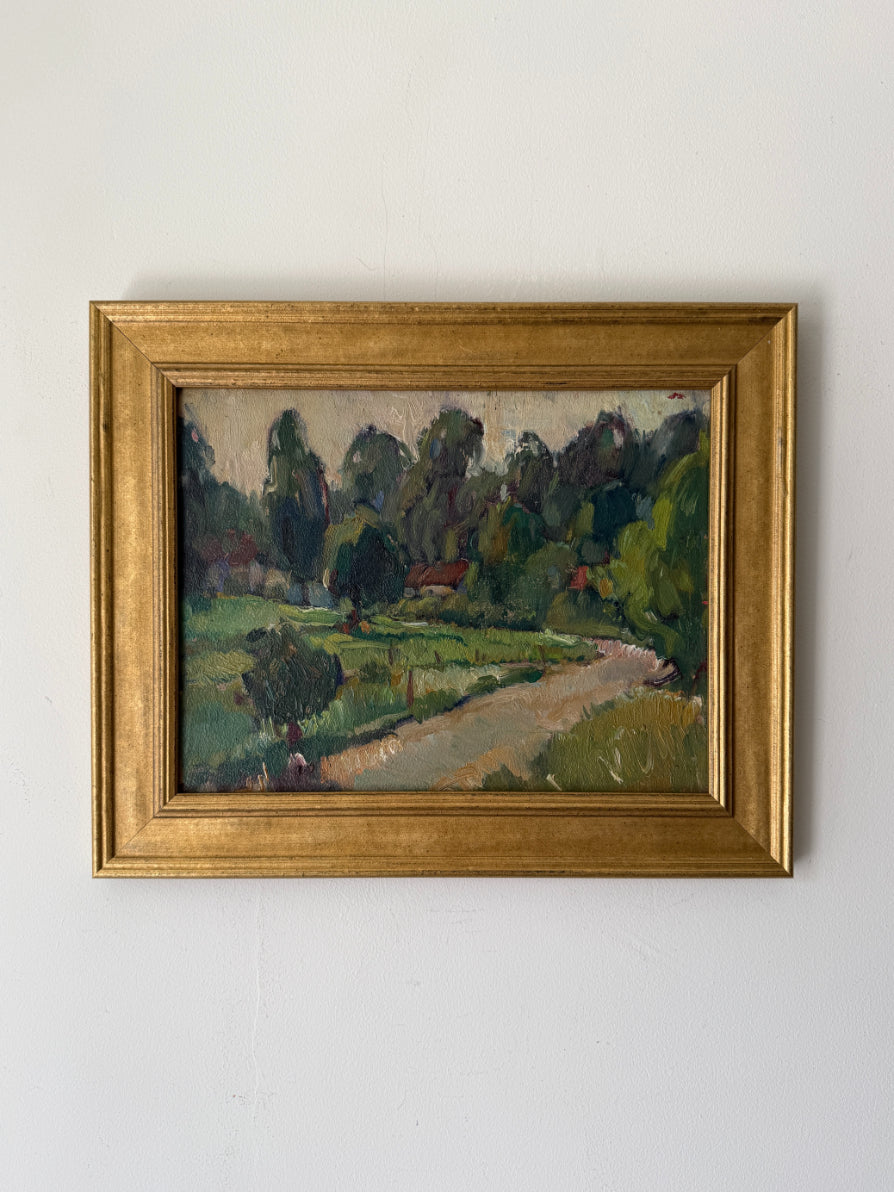 A framed vintage landscape oil painting featuring a winding path through green fields and trees. Available at Hue.