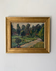 A framed vintage landscape oil painting featuring a winding path through green fields and trees. Available at Hue.