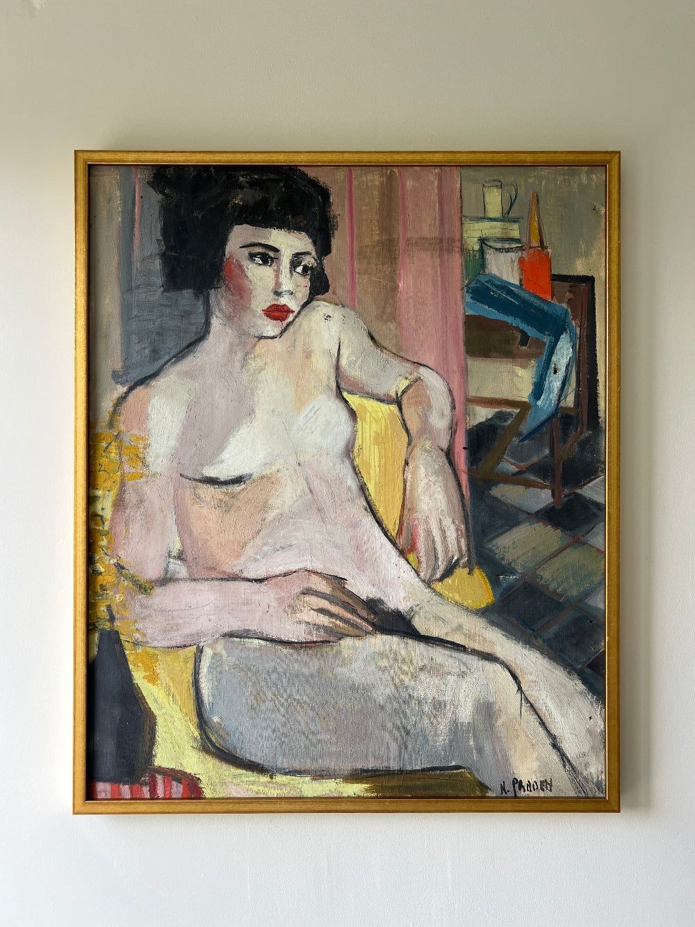 Framed vintage oil painting of a nude figure on a yellow chair in a slim gilt frame, available at Hue.