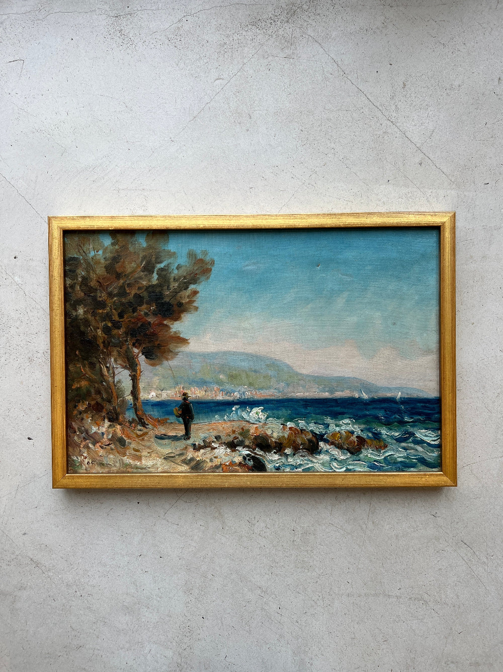Framed vintage oil painting of a coastal scene with a figure by a tree, available at Hue.