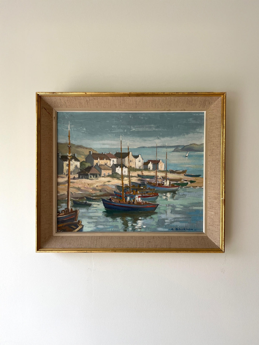 Framed vintage oil painting of a harbour scene with boats, available at Hue.