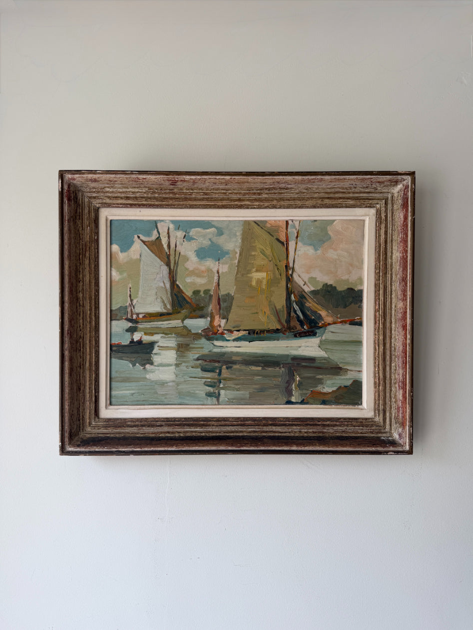 Framed vintage oil painting of sailboats on a calm water. Available at Hue. 