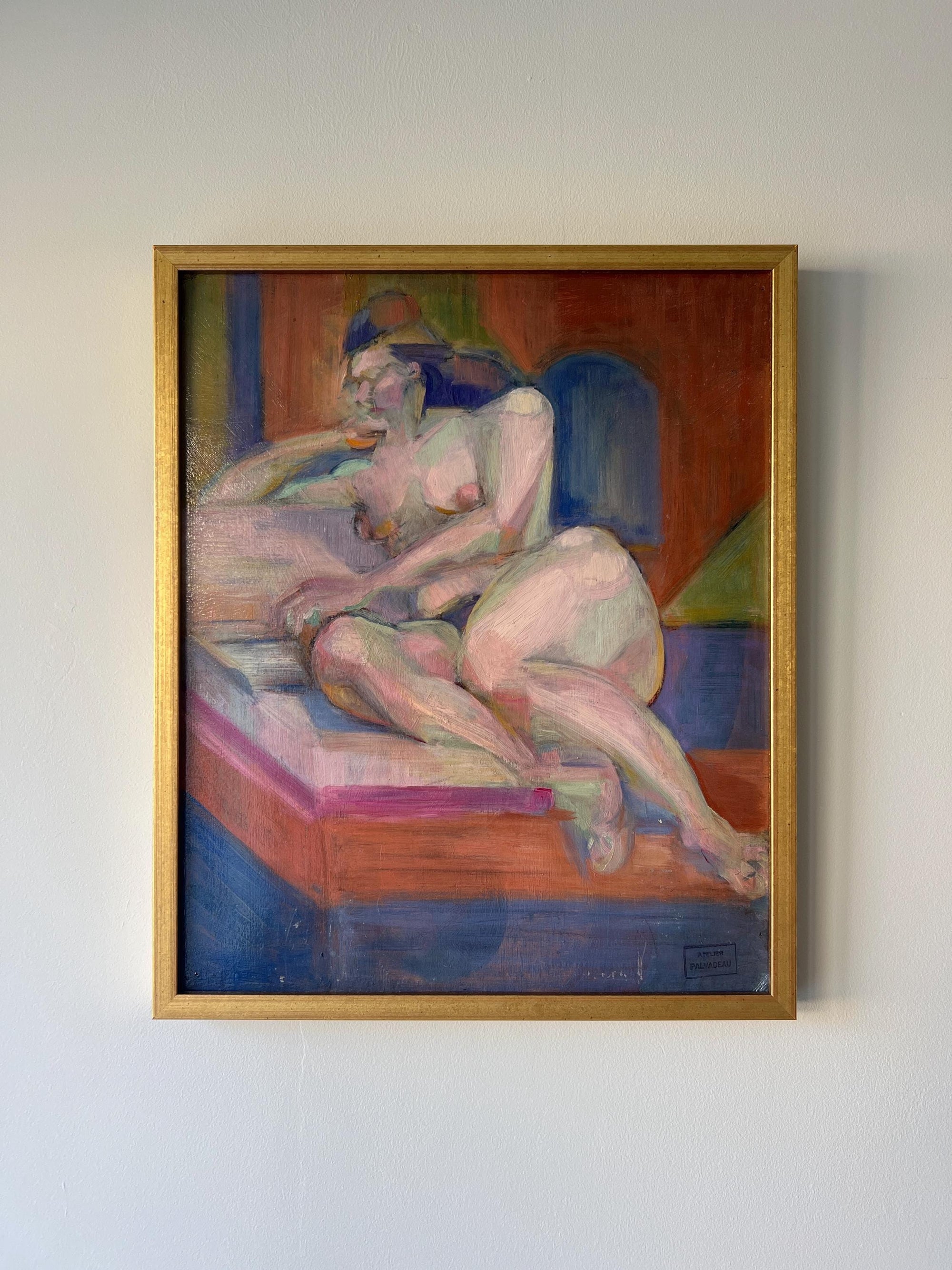 Framed vintage oil painting of a nude figure on a couch in a slim gilt frame, available at Hue.