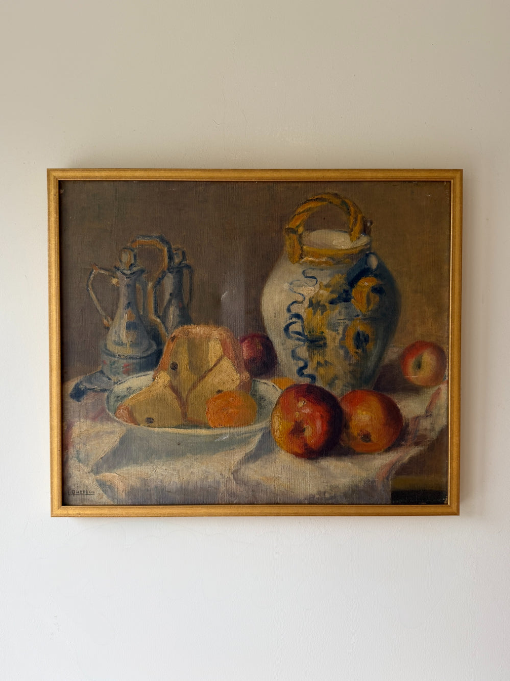 Framed vintage oil still life painting with fruits and a vase on a table. Available at Hue. 