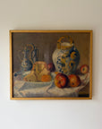 Framed vintage oil still life painting with fruits and a vase on a table. Available at Hue. 