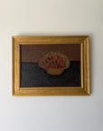 A framed vintage still life oil painting depicting a bowl of red cherries on a dark surface. Available at Hue. 