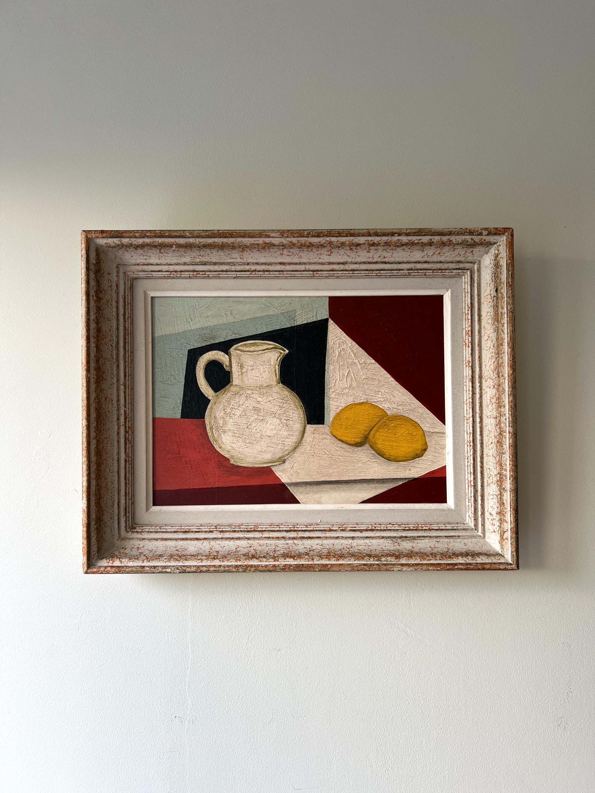 Framed vintage still life painting with a jug and lemons on a checkered cloth, available at Hue.