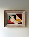 Framed vintage still life painting with a jug and lemons on a checkered cloth, available at Hue.