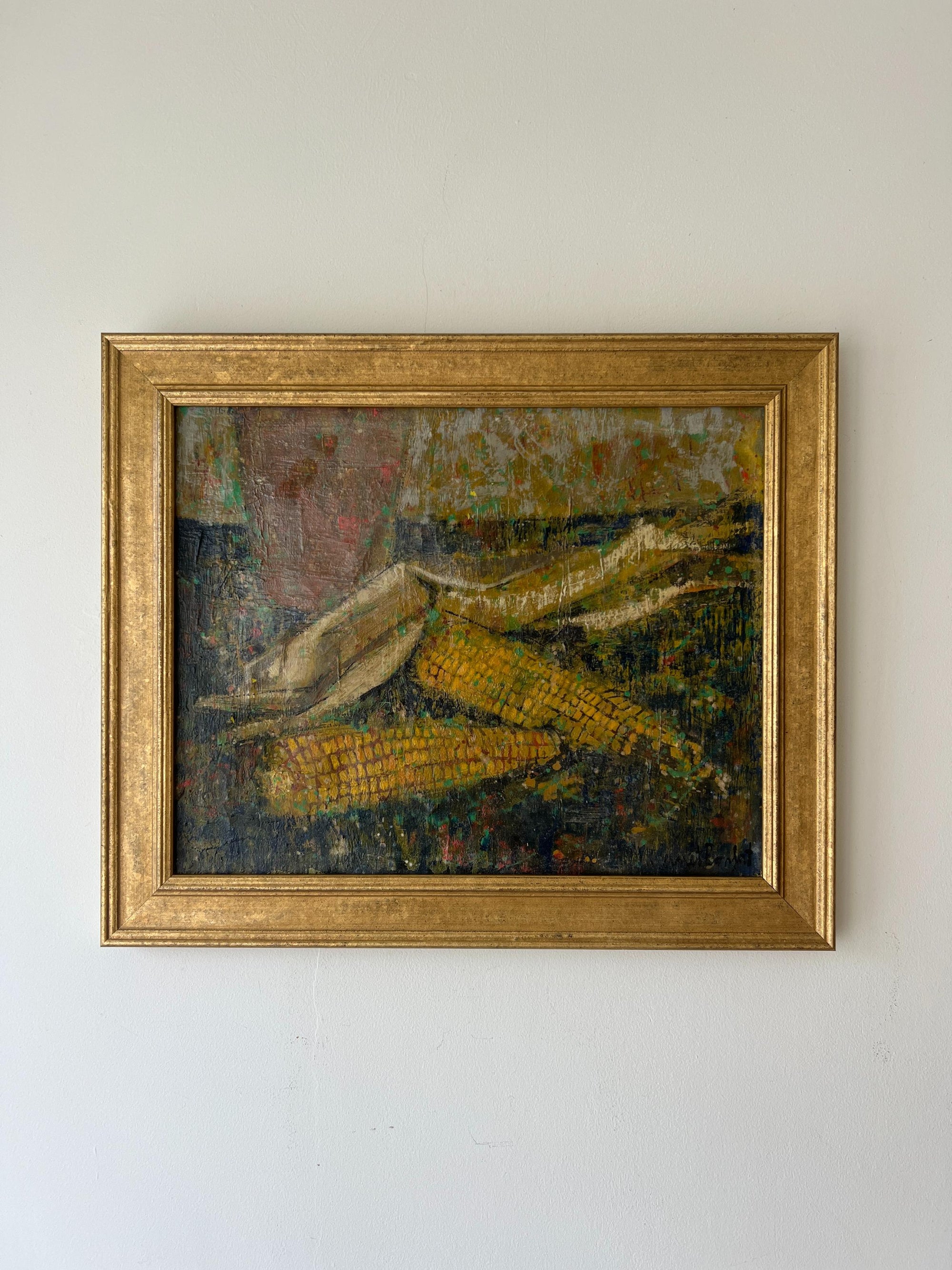 A framed vintage oil painting of two sheaves of corn on a dark, rustic background. Available at Hue.