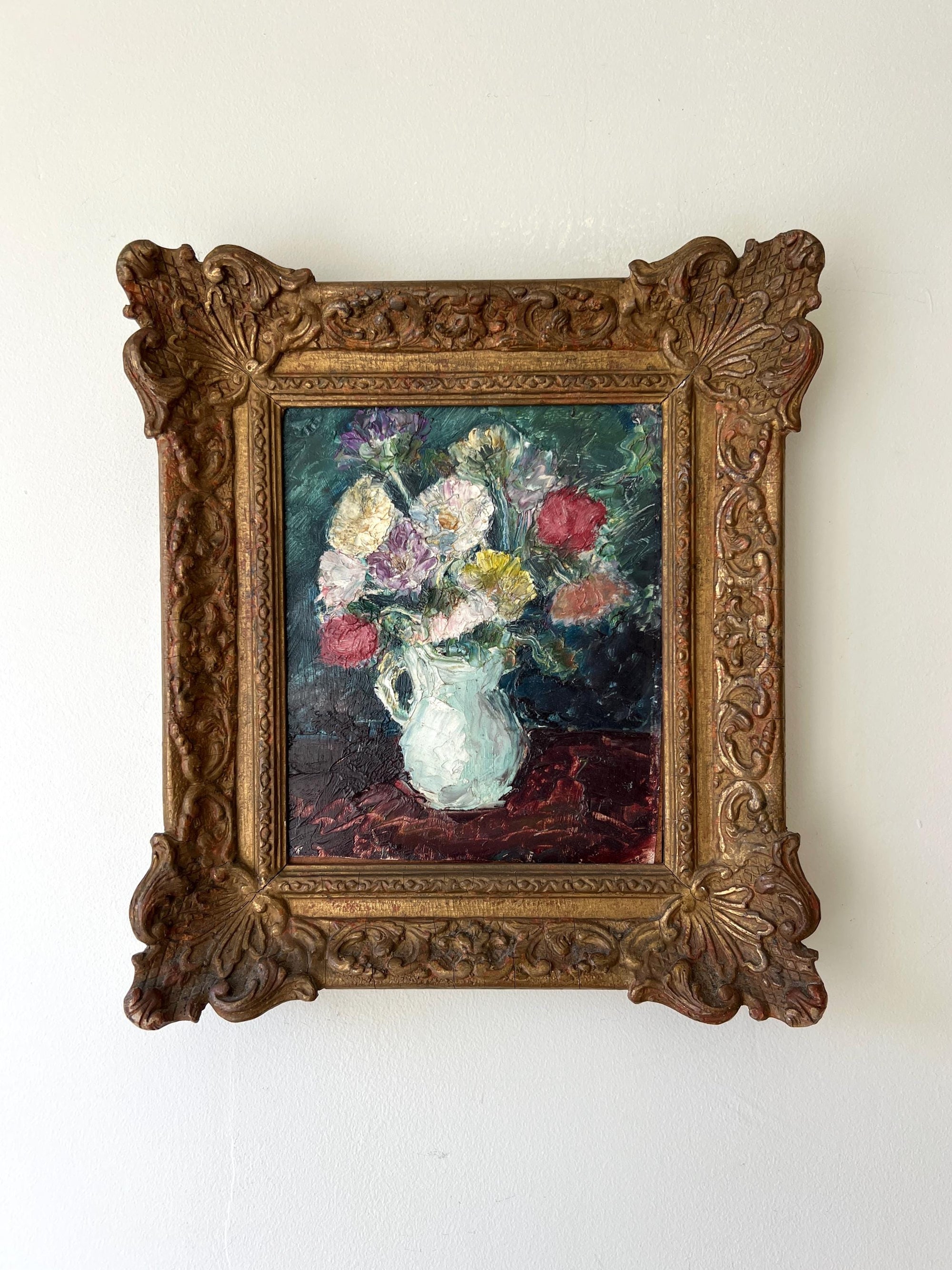 Framed vintage oil painting of a bouquet flowers in a white jug with an ornate gilt vintage frame, available at Hue