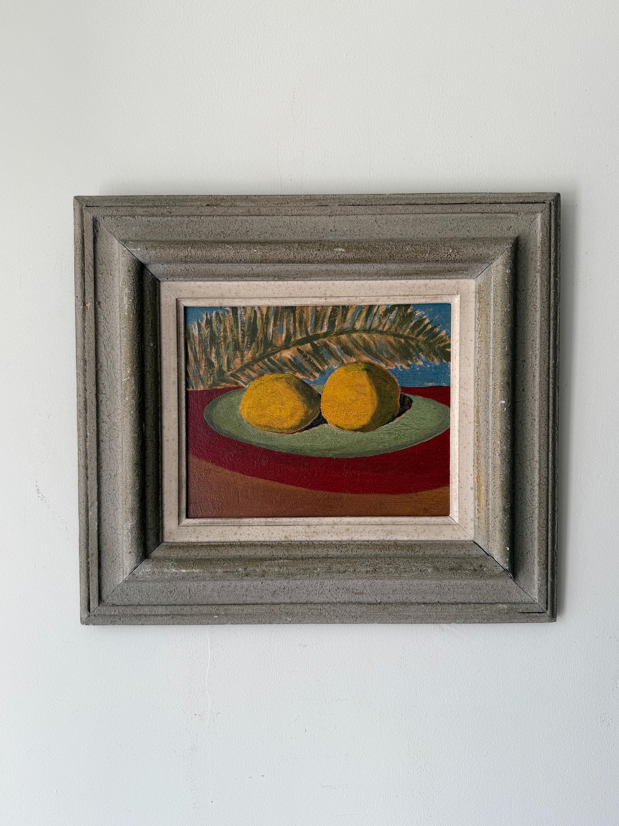 Framed oil painting of lemons and a single fern leaf. Available at Hue. 