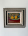 Framed oil painting of lemons and a single fern leaf. Available at Hue. 