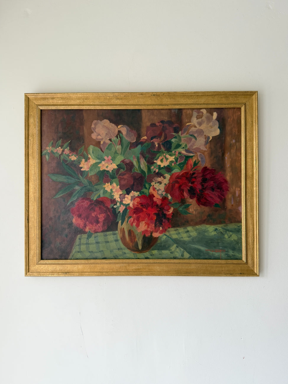 Framed vintage oil painting of a still life with flowers on a table. Available at Hue.