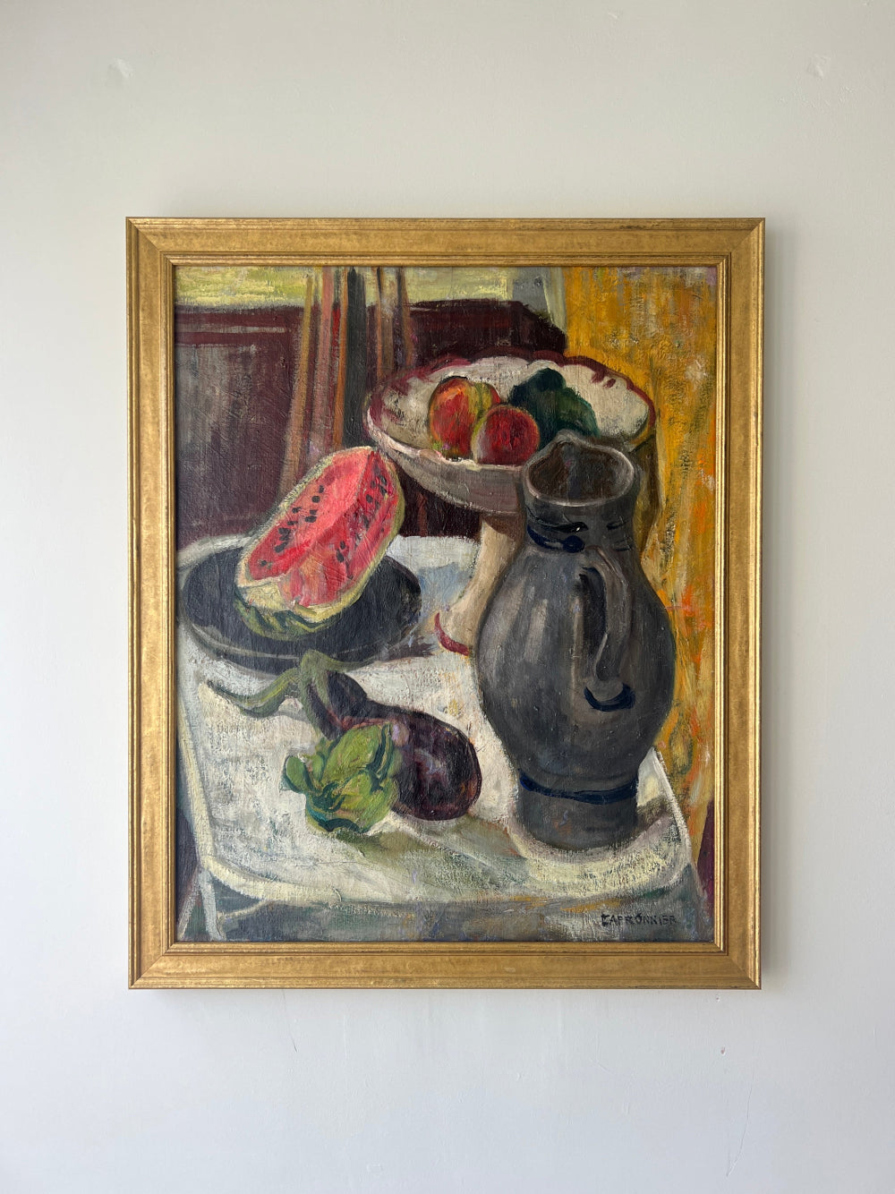 Framed still life oil vintage painting with watermelon, fruit, and pitcher on a table, available at Hue.