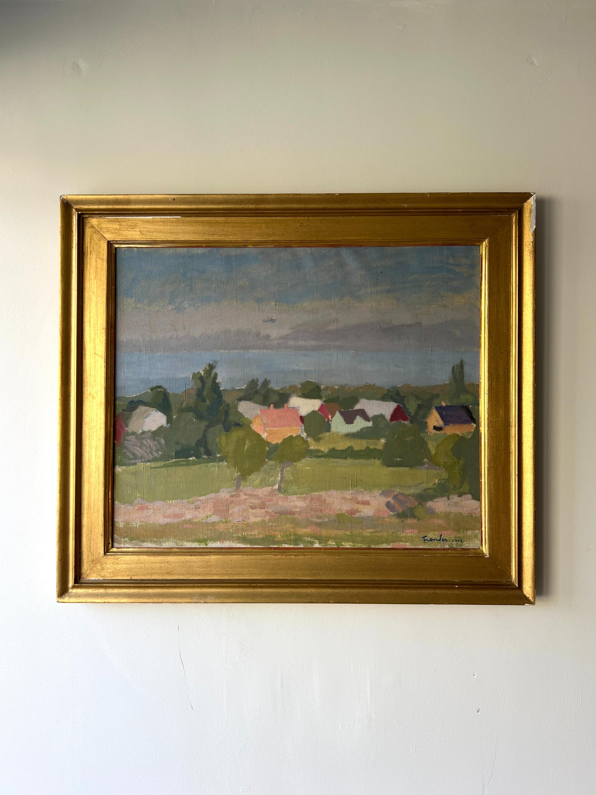 Framed vintage oil painting in a gilt frame depicting an impressionistic village scene, available at Hue. 