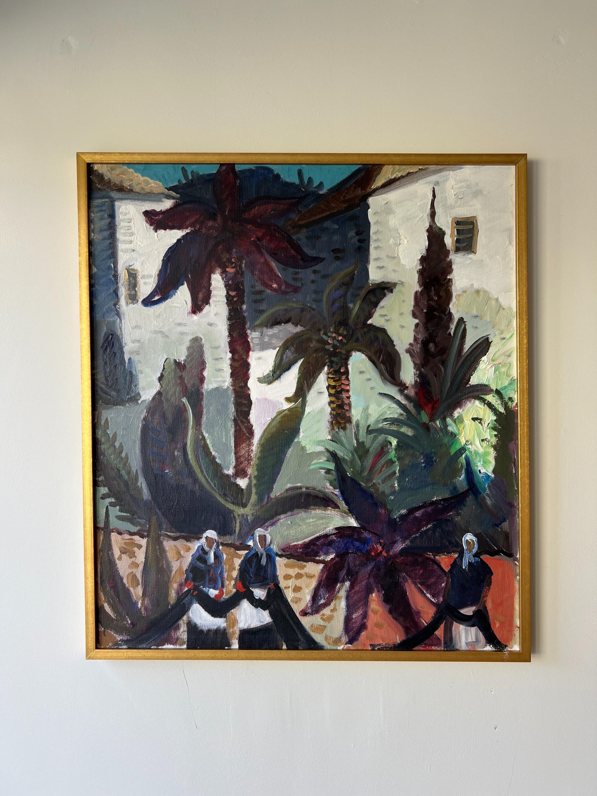 Large vintage oil painting of a Spanish street scene with whitewashed walls and women among the palms and agave plants, available at Hue.