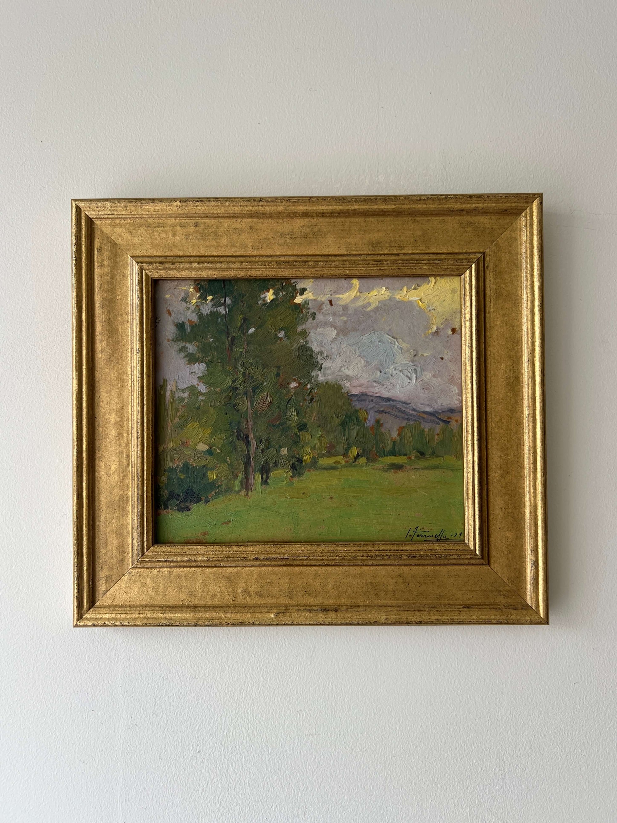 Framed vintage oil painting of a landscape with trees and a meadow, available at Hue.