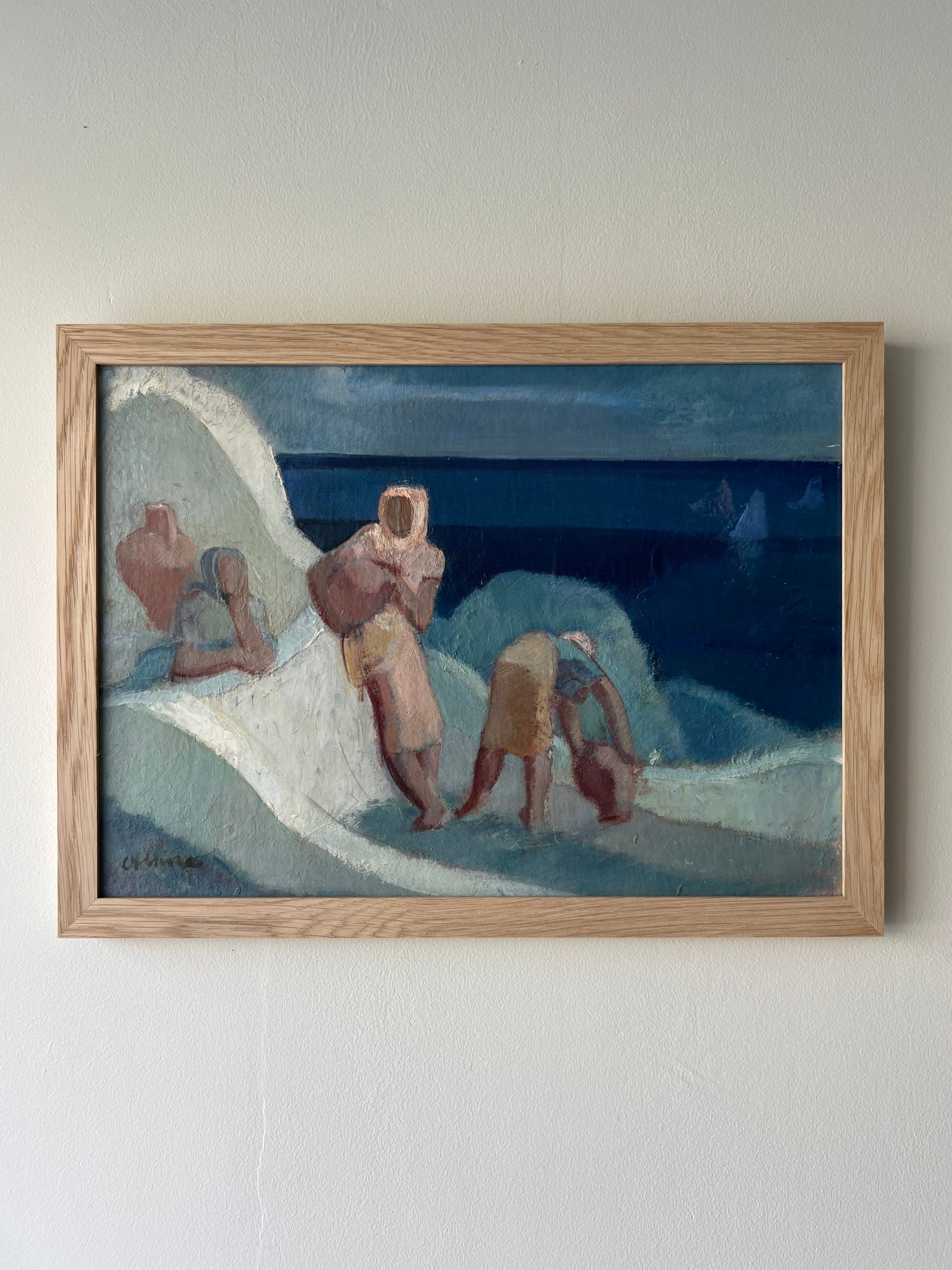 Framed vintage artwork of semi-abstract figures against a blue sky in a solid oak frame, available at Hue