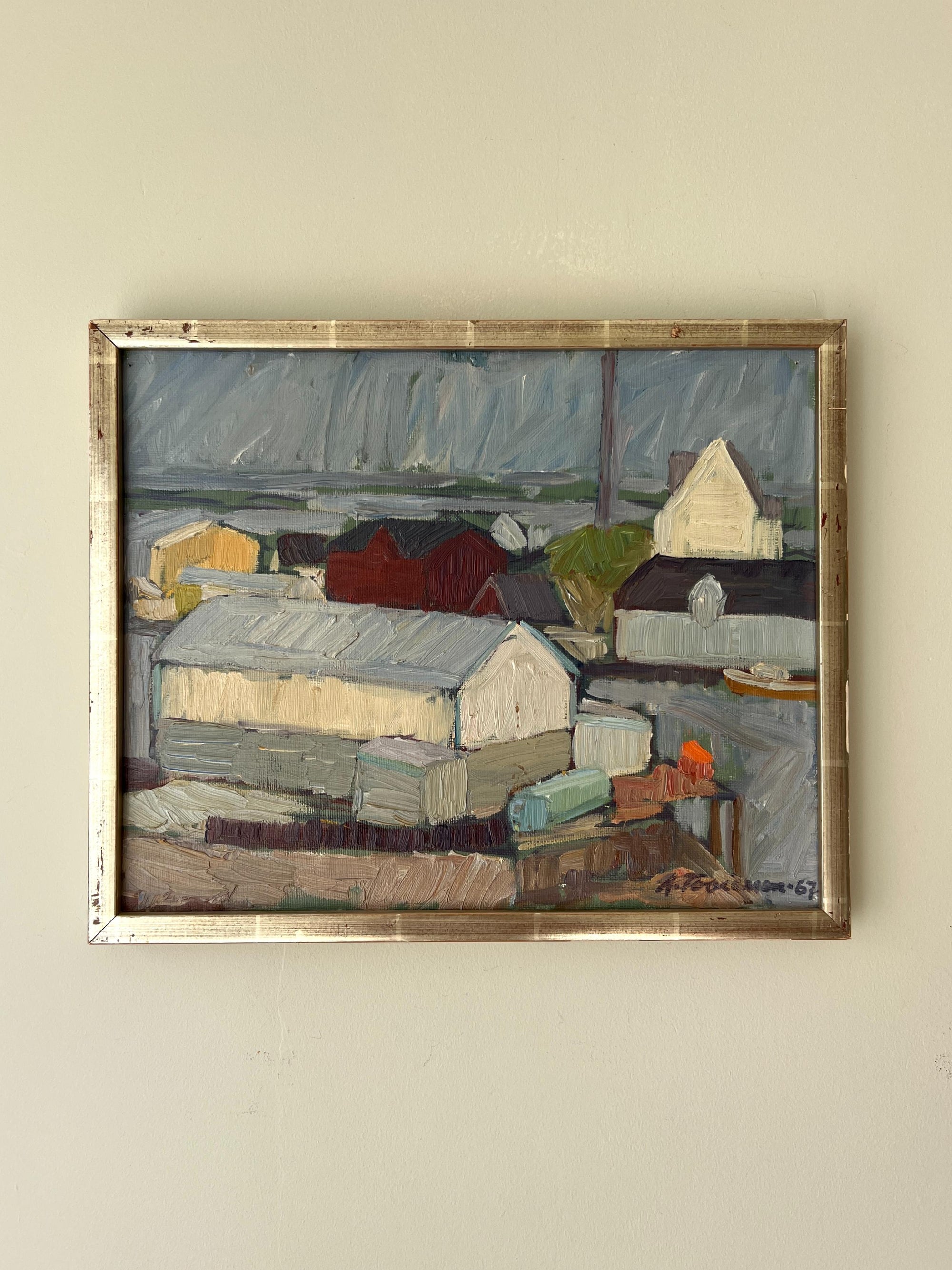 Framed vintage oil  painting of a coastal scene with buildings and water in a vintage silver gilt frame, available at Hue.