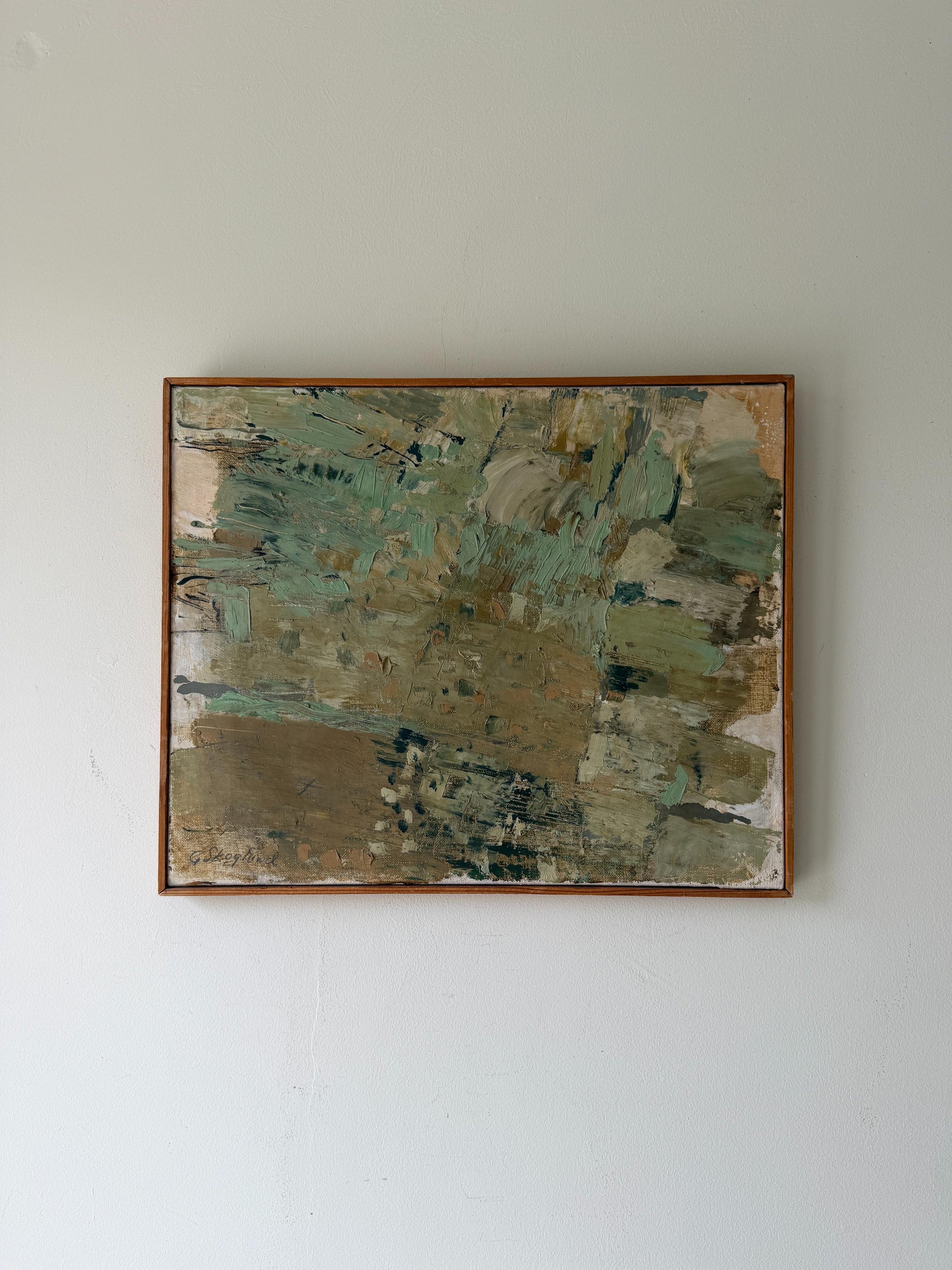 An abstract framed vintage oil painting with textured brushstrokes in muted green, beige, brown, and grey tones. Available at Hue.
