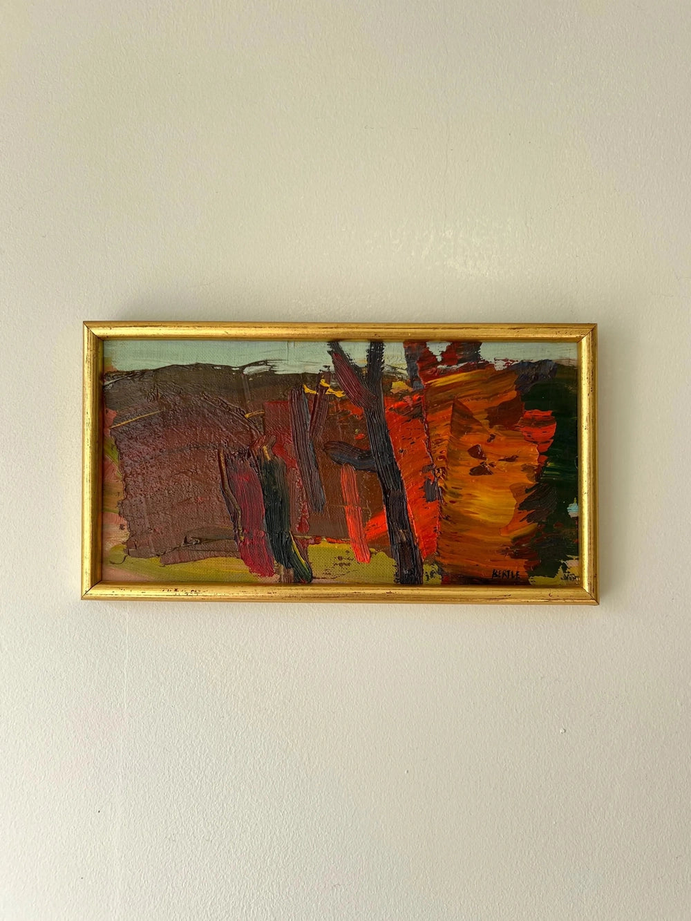Framed painting of a red abstract landscape in a vintage frame, available from hue