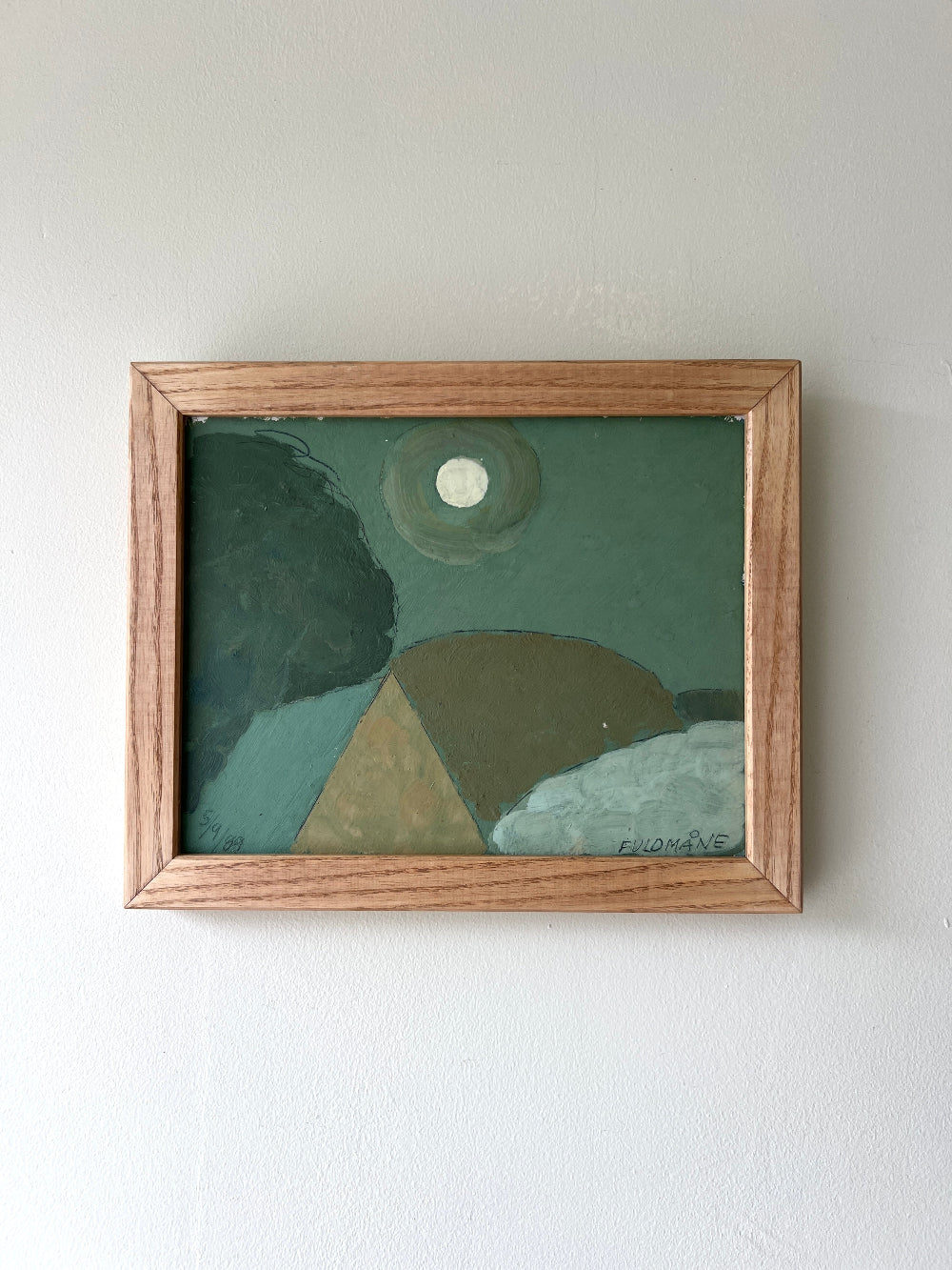 Framed vintage abstract painting of the moon rising over a green landscape with geometric shapes, available at Hue.