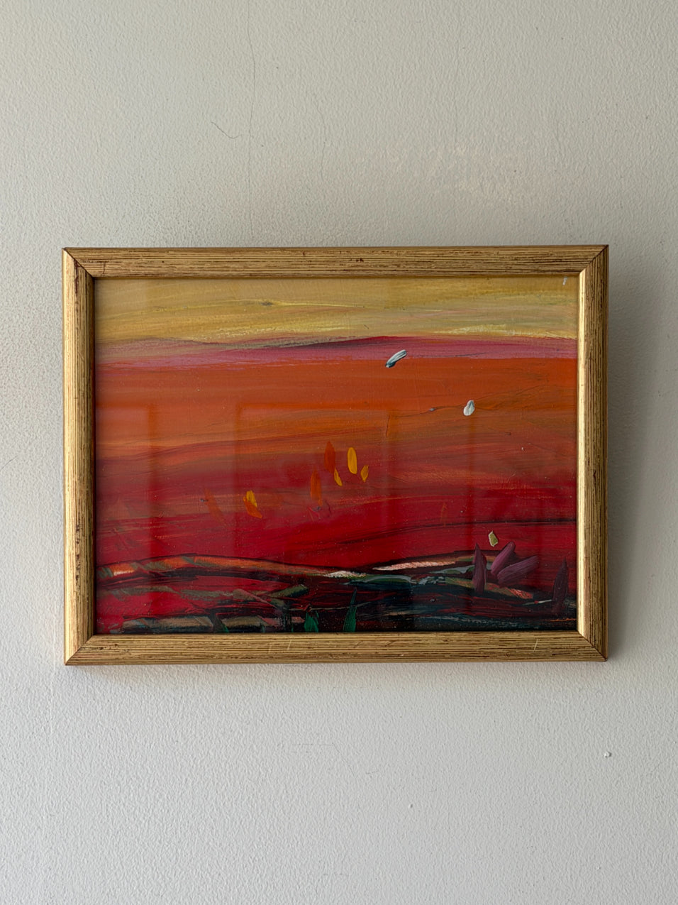 Framed vintage abstract oil painting with red and orange hues. Available at Hue. 