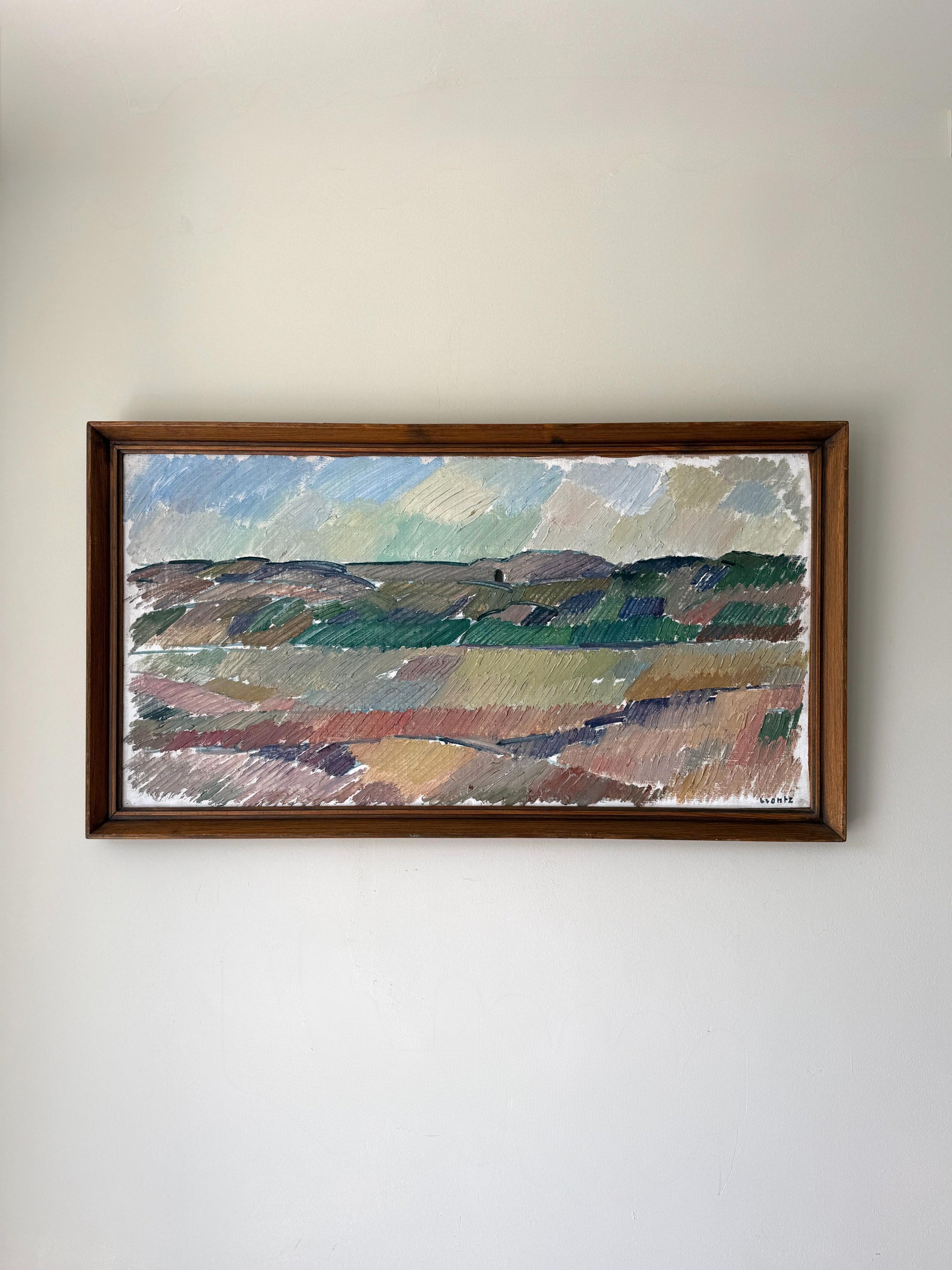 Framed vintage oil landscape painting of fields and distant mountains. Available at Hue. 
