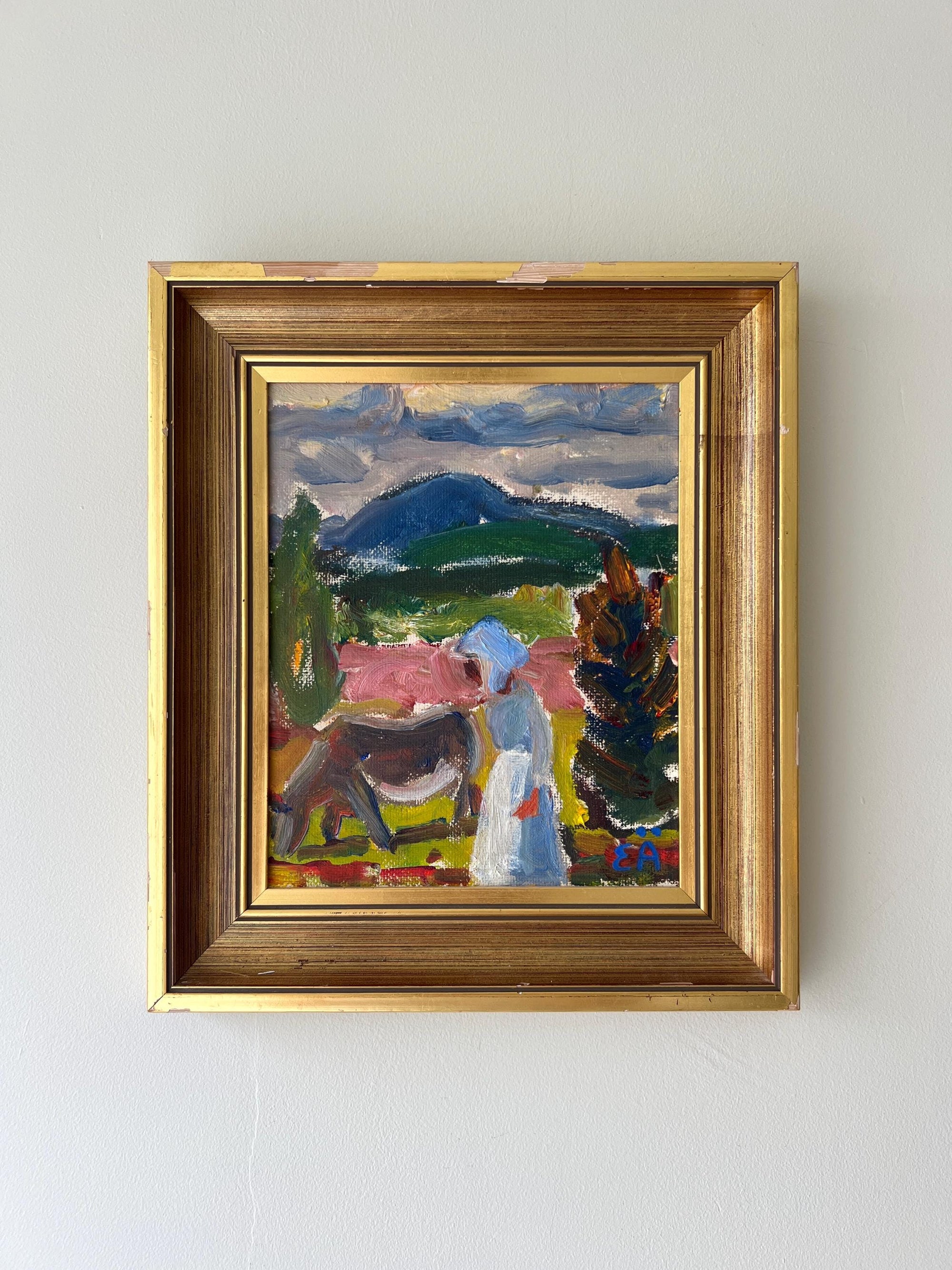 Framed vintage painting of a landscape with a female figure in a vintage gilt frame, available at Hue.