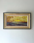 Framed vintage oil painting of a summer landscape with a  glowing yellow and orange horizon. Available at Hue.
