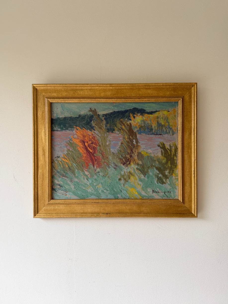 Framed vintage oil painting of a landscape with colourful grasses by a lake. Available at Hue.