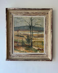 Framed vintage oil painting of a landscape with trees and fields. Available at Hue.