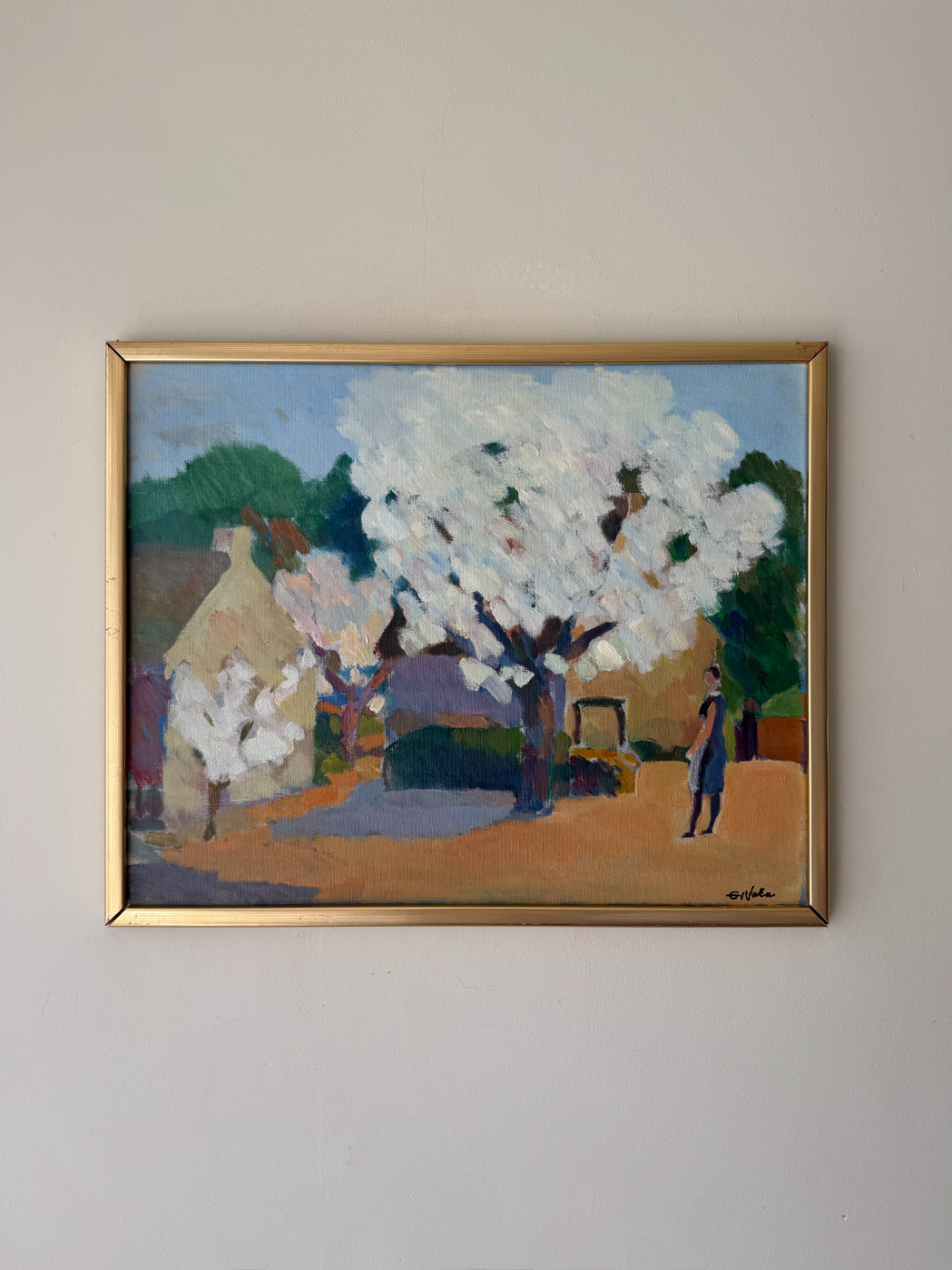 Framed vintage oil painting of a landscape with blossom trees and a person. Available at Hue. 