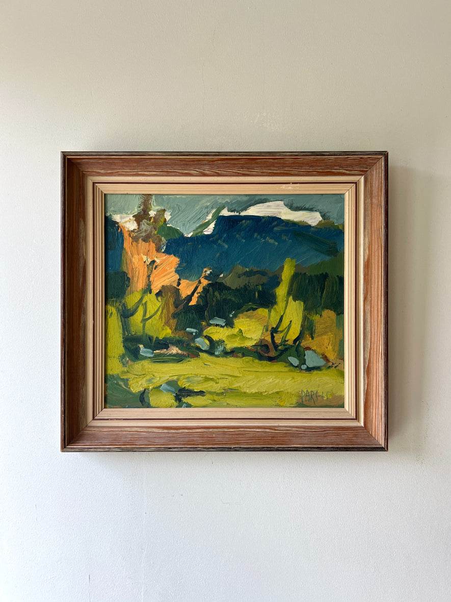 Framed vintage oil painting of a semi-abstract landscape with trees and distant snow capped mountains. Available at Hue.