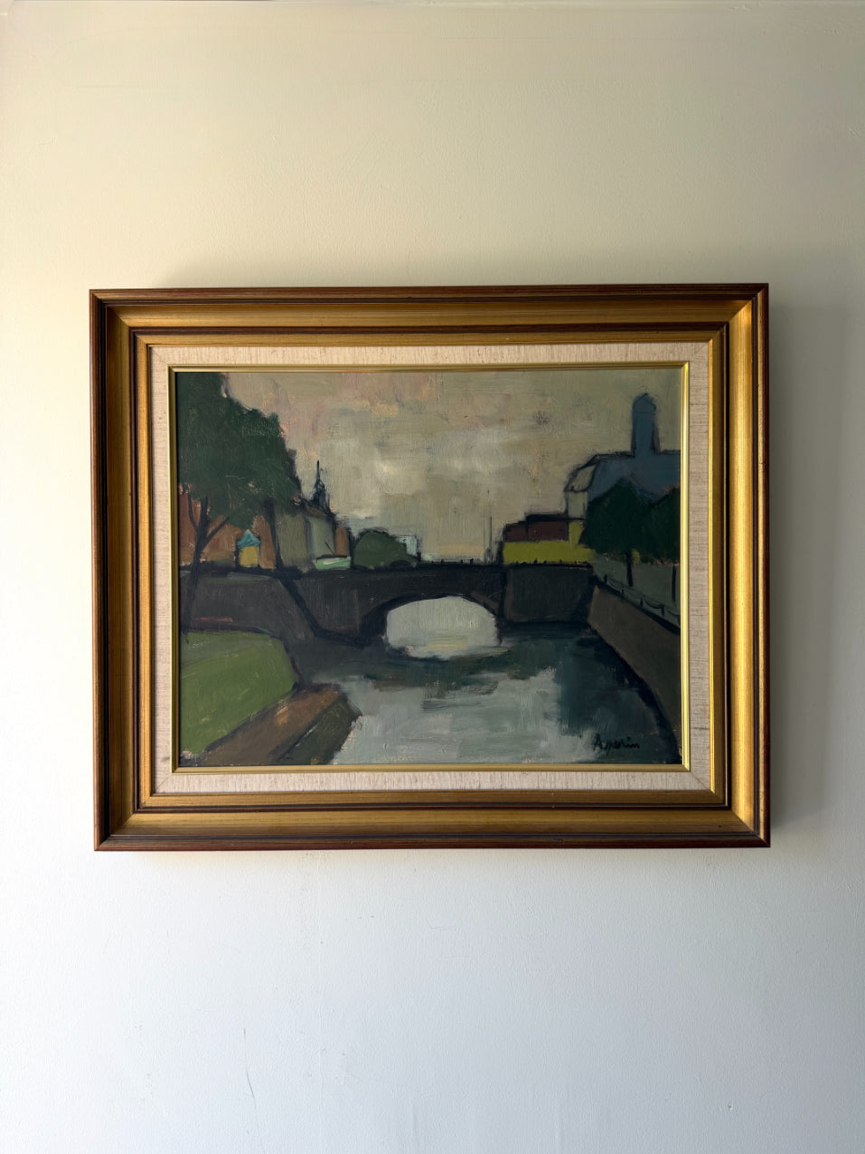 Framed vintage oil painting of a landscape with a bridge over a canal. Available at Hue.
