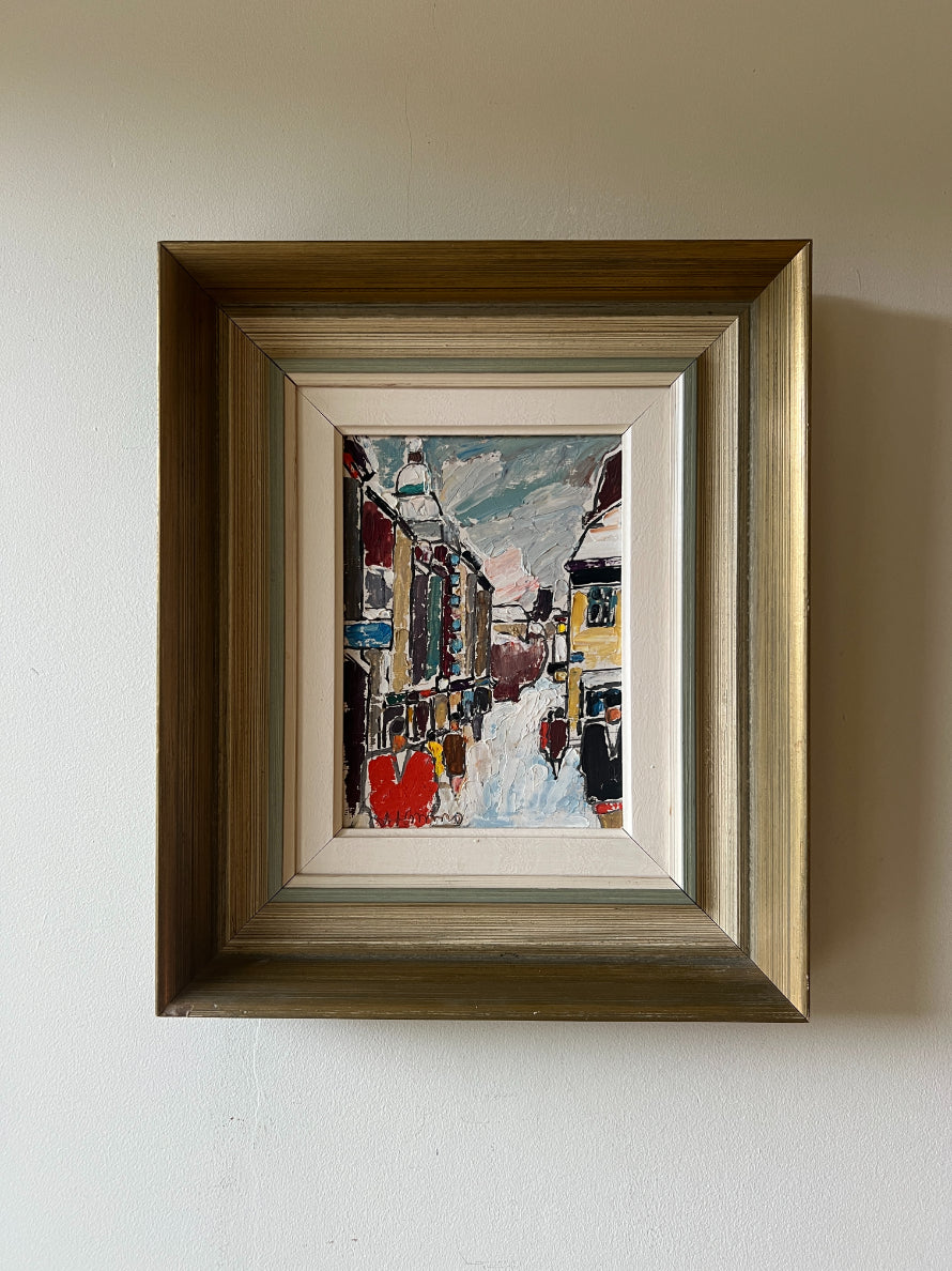 Framed vintage oil painting of a city street scene in the snow. Available at Hue.