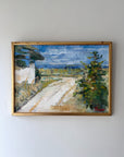 Framed vintage oil painting of a landscape with a road and trees. Available at Hue. 