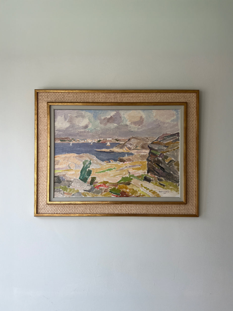 Framed vintage oil painting of a seascape with coastline and sailing boats. Available at Hue. 