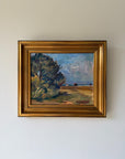 Framed vinatge oil painting of a landscape with trees and blue sky. Available at Hue. 