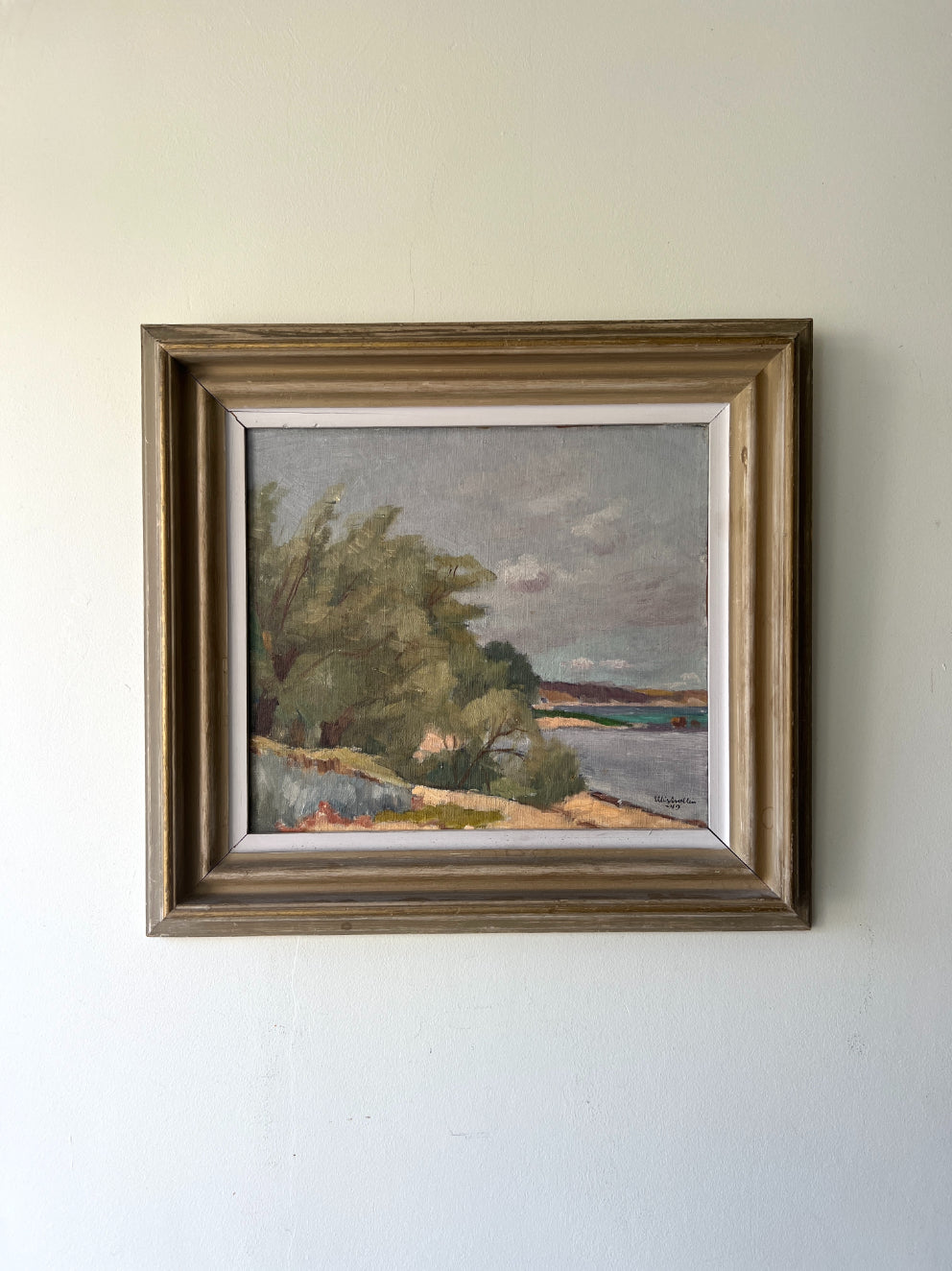 Framed vintage oil painting of a landscape with trees and water. Available at Hue. 