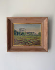 Framed vintage oil painting of ploughed farm fields and a distant farmhouse with trees. Available at Hue.