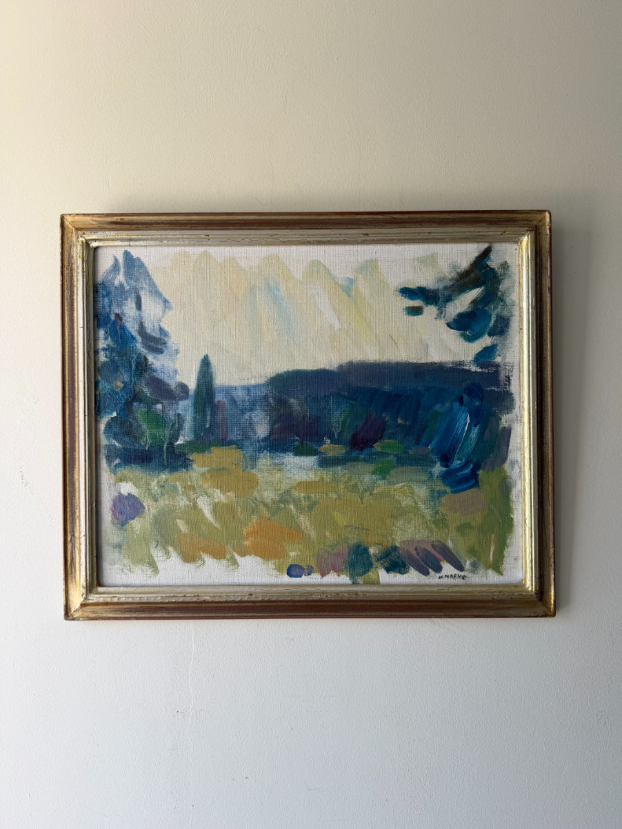 Framed vintage oil painting of a landscape with blue and green tones. Available at Hue. 