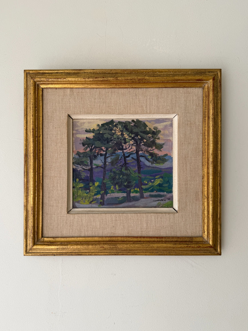 Framed vintage oil painting of pine trees. Available at Hue. 