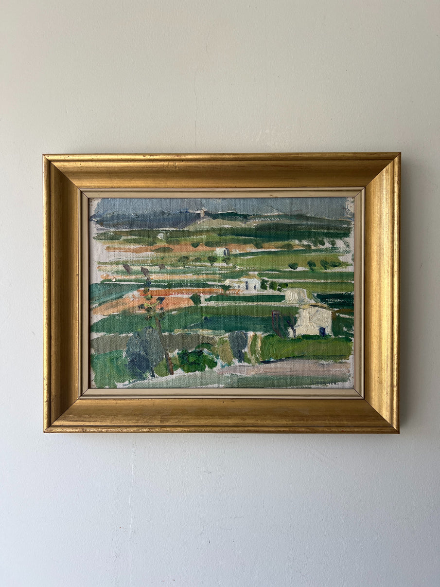 A framed vinatge oil painting of rural, impressionist patchwork fields. Available at Hue. 