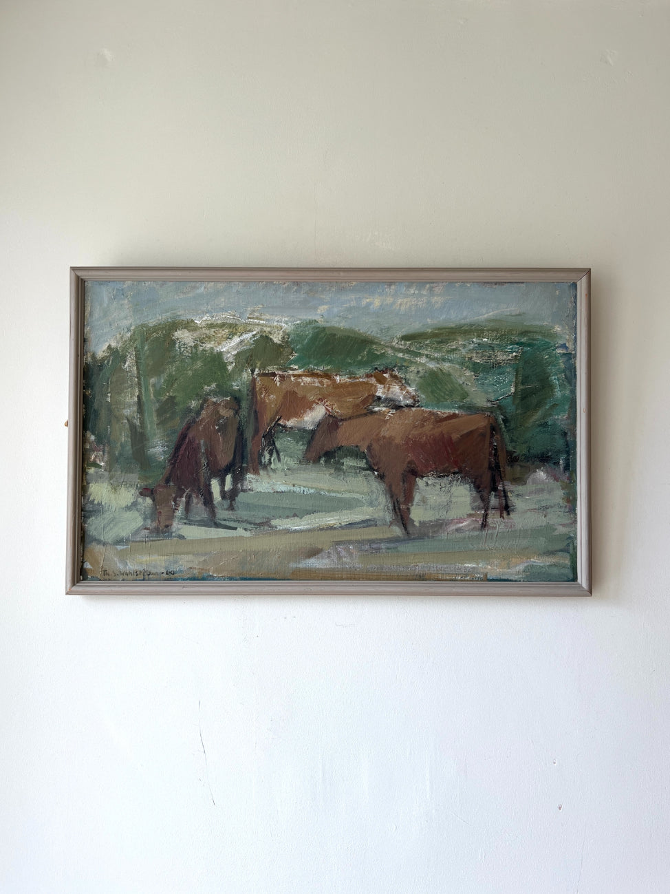 Framed vintage oil painting of cows in a field. Available at Hue.
