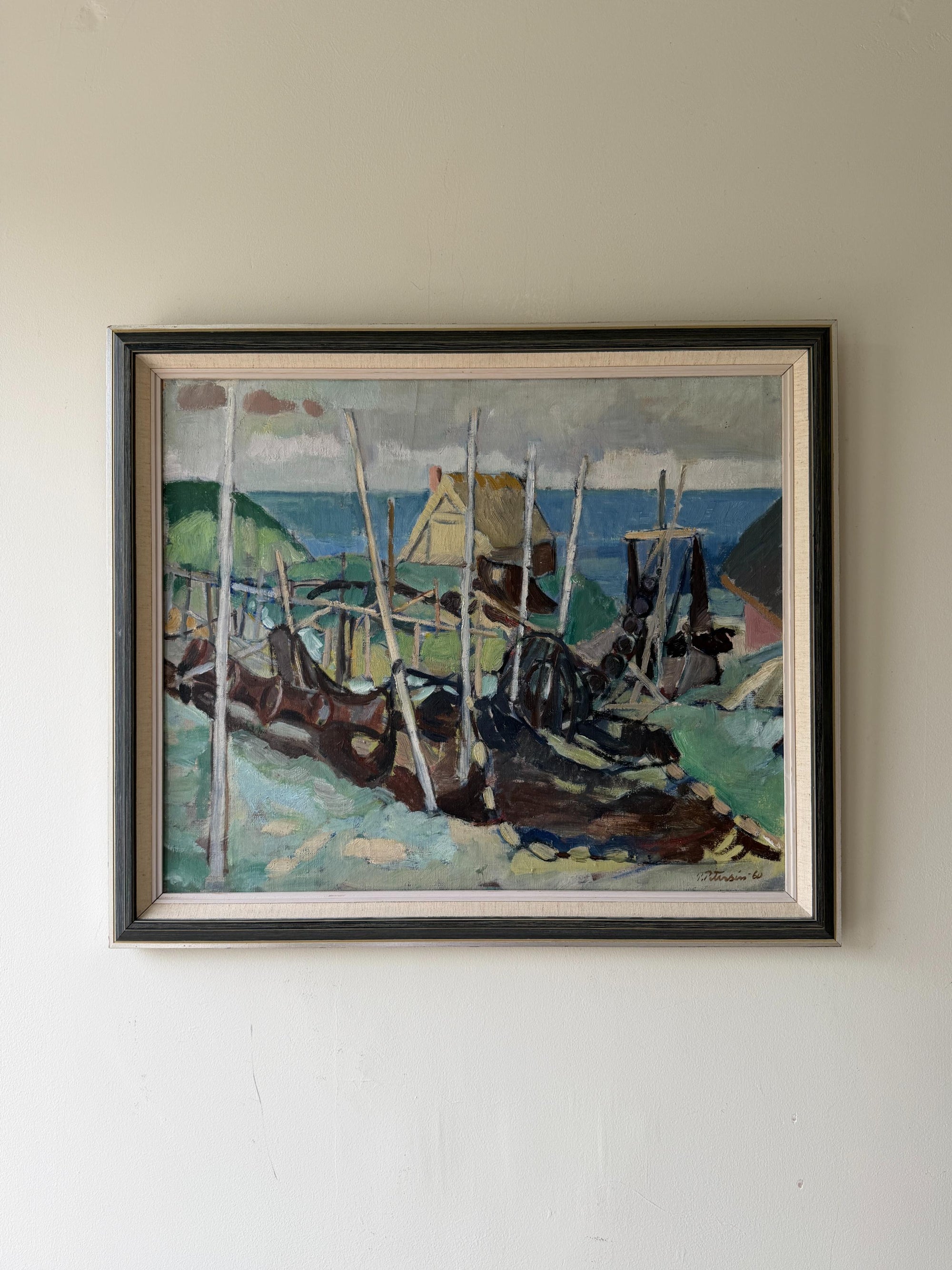 A framed vintage oil painting of fishing nets on a shoreline with a distant blue horizon. Available at Hue. 